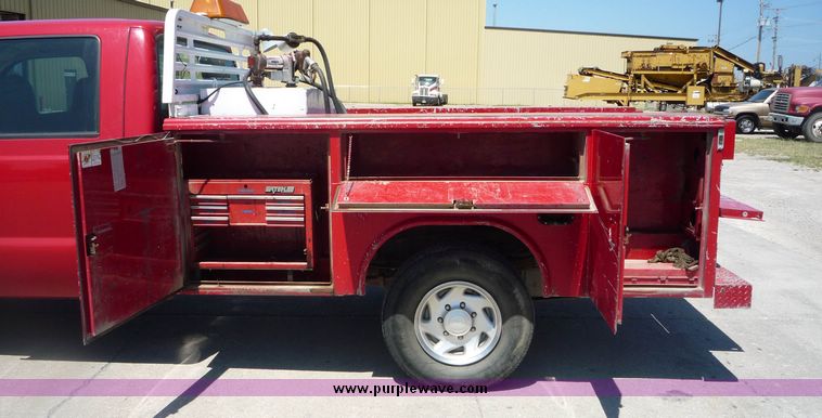 image for item 4043 2002 Ford F350 Super Duty crew cab pickup with Reading utility bed