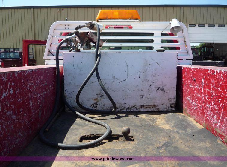 image for item 4043 2002 Ford F350 Super Duty crew cab pickup with Reading utility bed