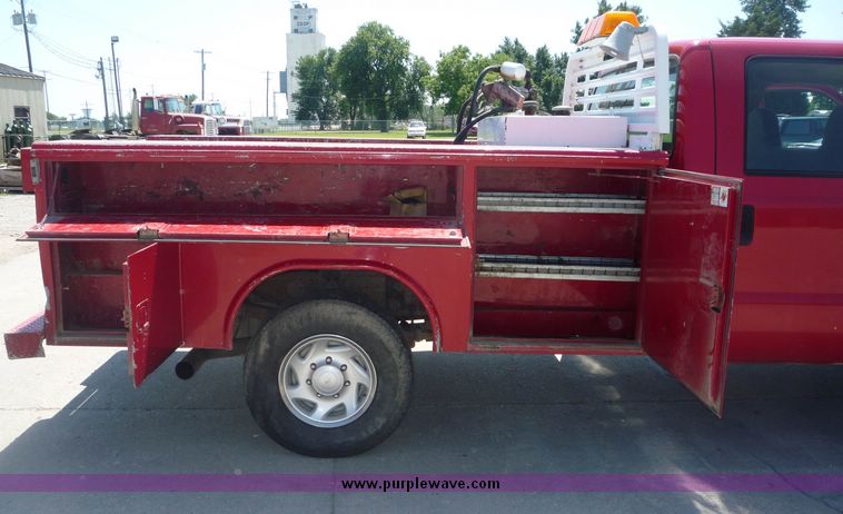 image for item 4043 2002 Ford F350 Super Duty crew cab pickup with Reading utility bed