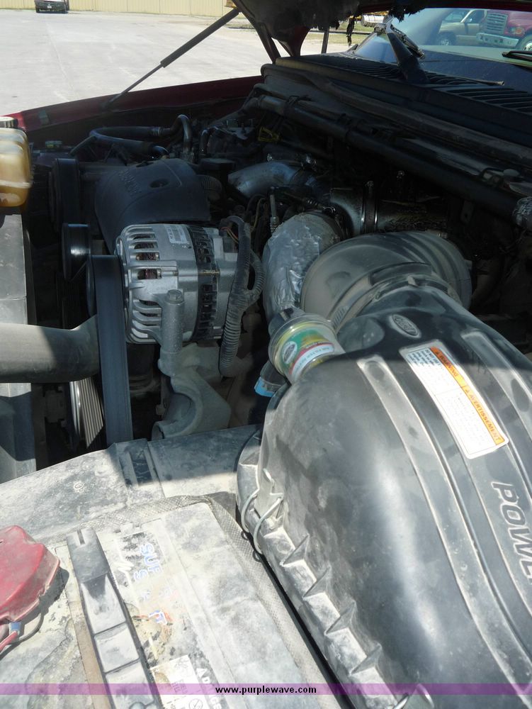 image for item 4043 2002 Ford F350 Super Duty crew cab pickup with Reading utility bed