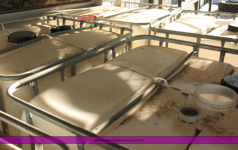 image for item 4391 (5) 250 gallon plastic totes