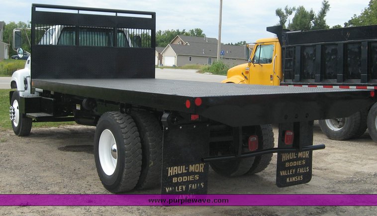 image for item 8631 1998 GMC C-Series C7500 truck with 17' flat bed and Obeco hoist
