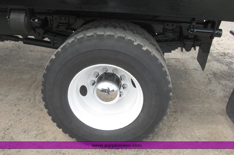 image for item 8631 1998 GMC C-Series C7500 truck with 17' flat bed and Obeco hoist