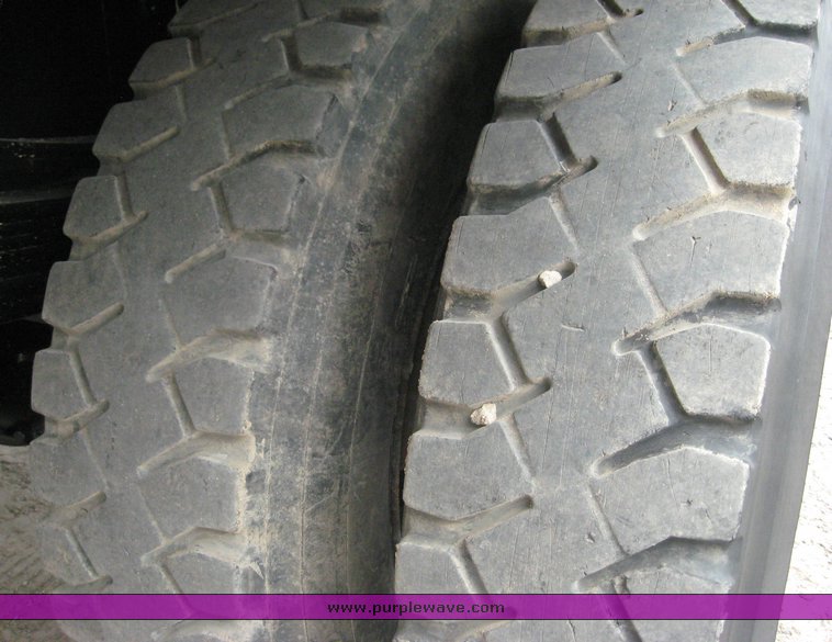 image for item 8631 1998 GMC C-Series C7500 truck with 17' flat bed and Obeco hoist