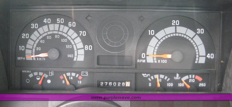 image for item 8631 1998 GMC C-Series C7500 truck with 17' flat bed and Obeco hoist