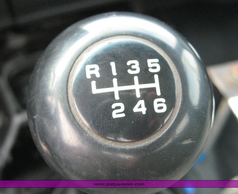 image for item 8631 1998 GMC C-Series C7500 truck with 17' flat bed and Obeco hoist