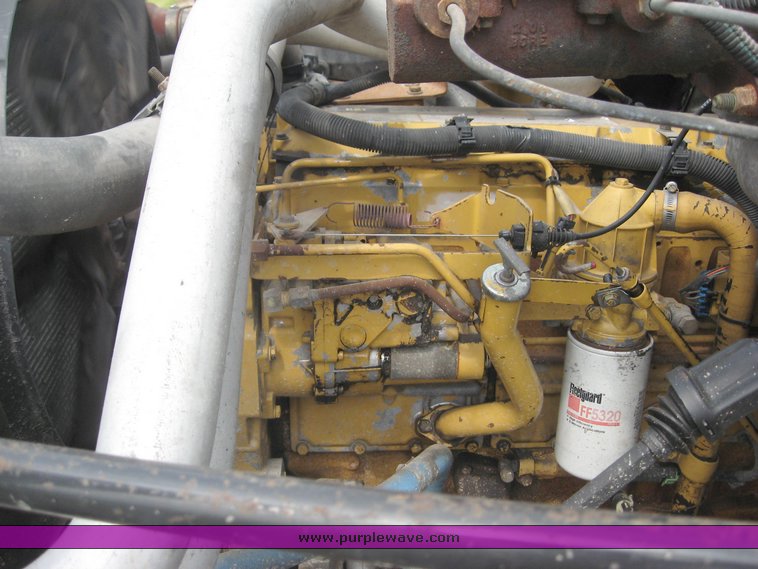 image for item 8631 1998 GMC C-Series C7500 truck with 17' flat bed and Obeco hoist