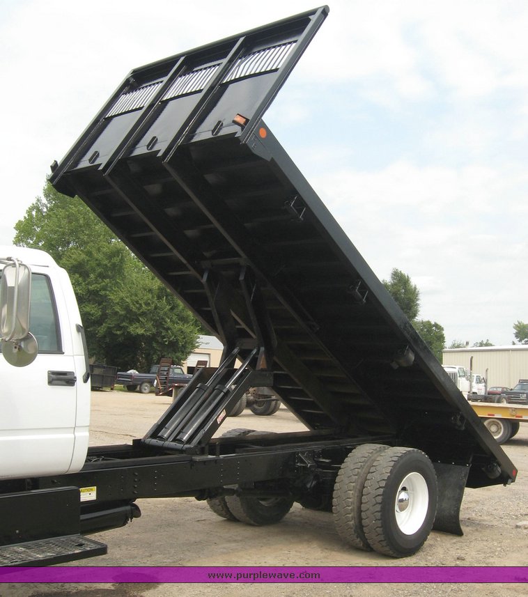 image for item 8631 1998 GMC C-Series C7500 truck with 17' flat bed and Obeco hoist