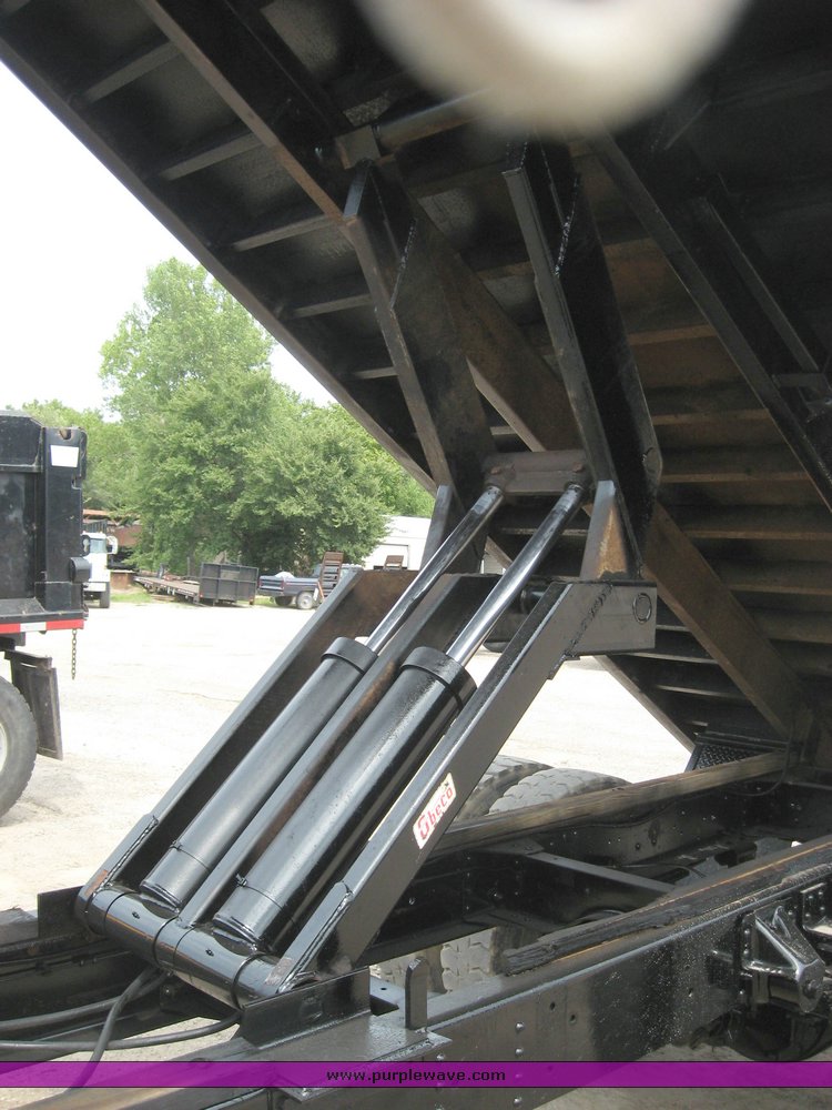 image for item 8631 1998 GMC C-Series C7500 truck with 17' flat bed and Obeco hoist