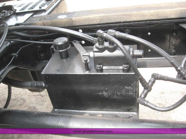 image for item 8631 1998 GMC C-Series C7500 truck with 17' flat bed and Obeco hoist