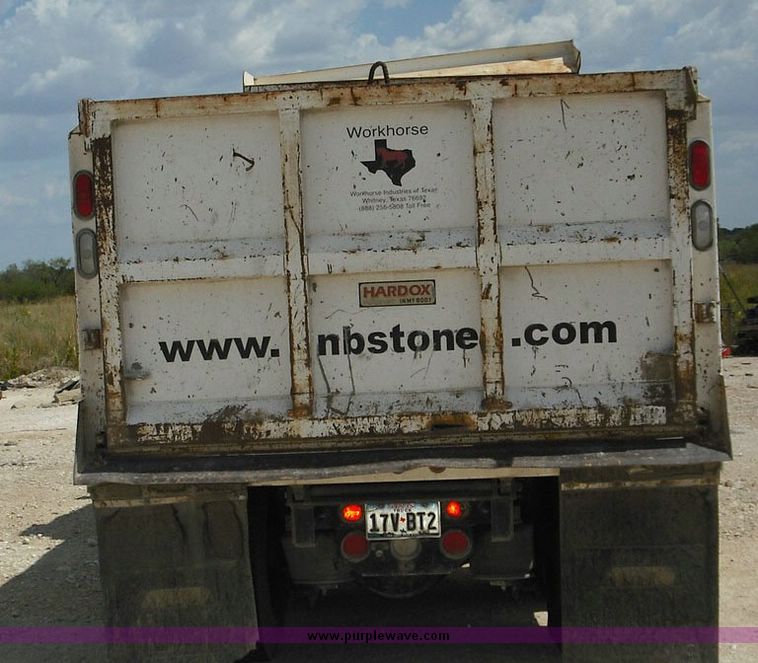 image for item 2296 2000 Freightliner Conventional FLC120 truck with Workhorse steel half round dump bed