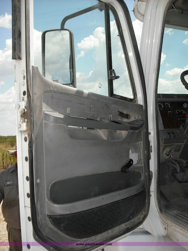 image for item 2296 2000 Freightliner Conventional FLC120 truck with Workhorse steel half round dump bed