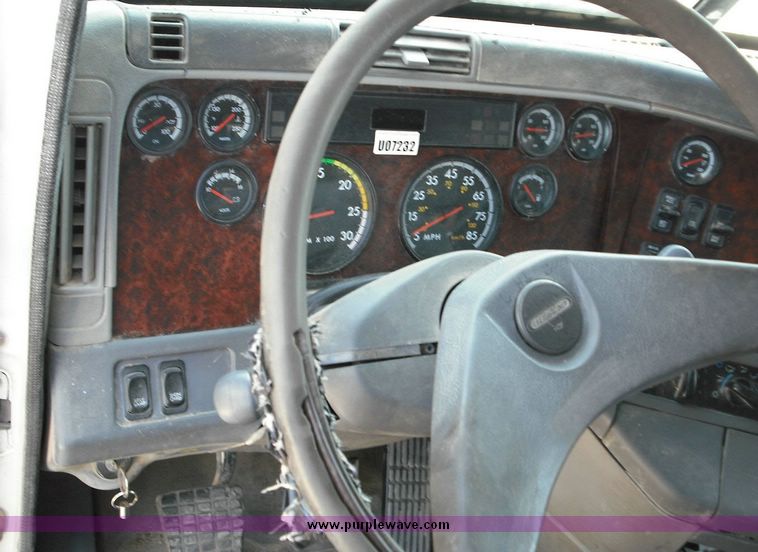 image for item 2296 2000 Freightliner Conventional FLC120 truck with Workhorse steel half round dump bed