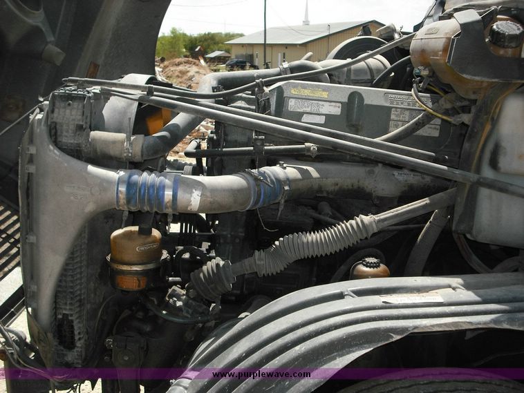 image for item 2296 2000 Freightliner Conventional FLC120 truck with Workhorse steel half round dump bed