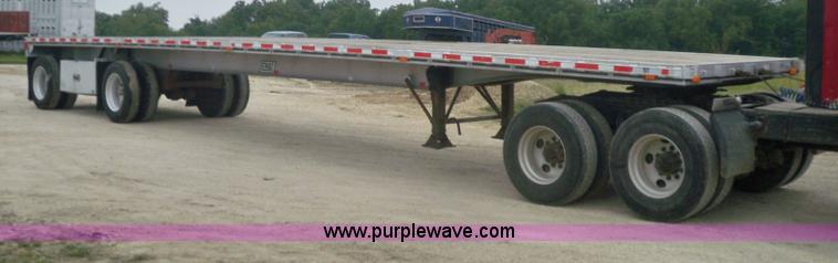 image for item 6950 1997 East 48'L x 96"W aluminum spread axle flatbed trailer