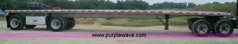 image for item 6950 1997 East 48'L x 96"W aluminum spread axle flatbed trailer