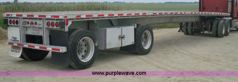 image for item 6950 1997 East 48'L x 96"W aluminum spread axle flatbed trailer