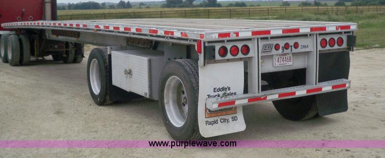 image for item 6950 1997 East 48'L x 96"W aluminum spread axle flatbed trailer