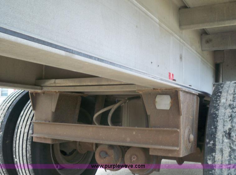 image for item 6950 1997 East 48'L x 96"W aluminum spread axle flatbed trailer