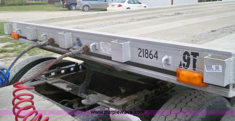 image for item 6950 1997 East 48'L x 96"W aluminum spread axle flatbed trailer
