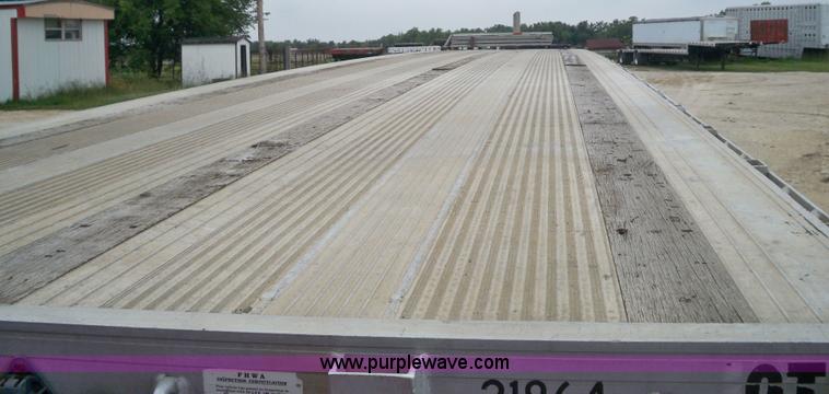 image for item 6950 1997 East 48'L x 96"W aluminum spread axle flatbed trailer