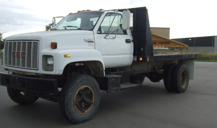image for item 6009 1991 GMC Topkick C7H042 flat bed truck