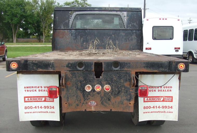 image for item 6009 1991 GMC Topkick C7H042 flat bed truck