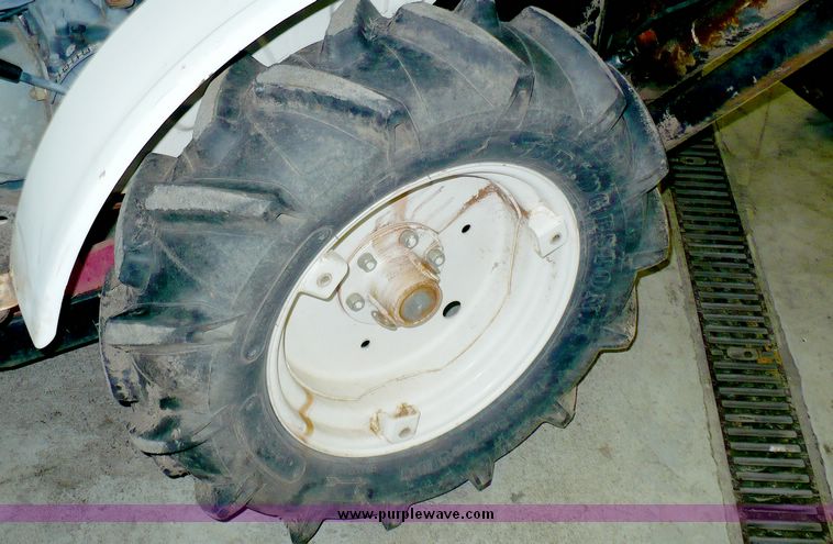 image for item 8561 Bolens G154 utility tractor with loader and backhoe