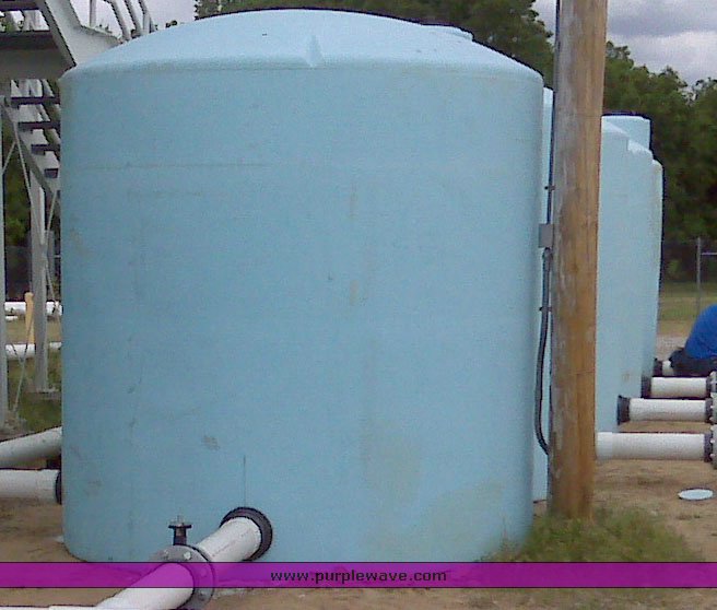 image for item 1301 (2) 3,000 gallon 5yr vertical plastic tanks