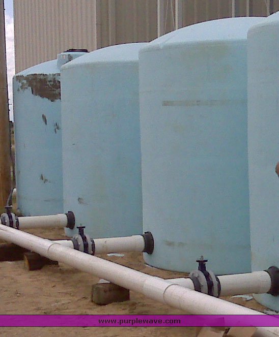 image for item 1302 (3) 3,000 gallon 5yr vertical plastic tanks