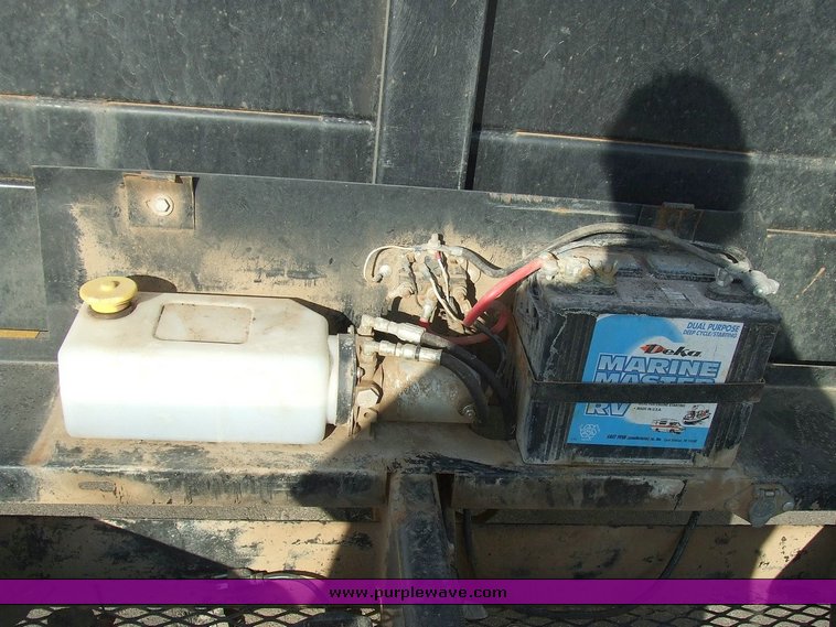 image for item 6068 2006 Haulmark 16' trailer with dump bed and hoist