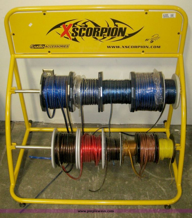 xScorpion wire rack with eleven partial spools of audio related wiring