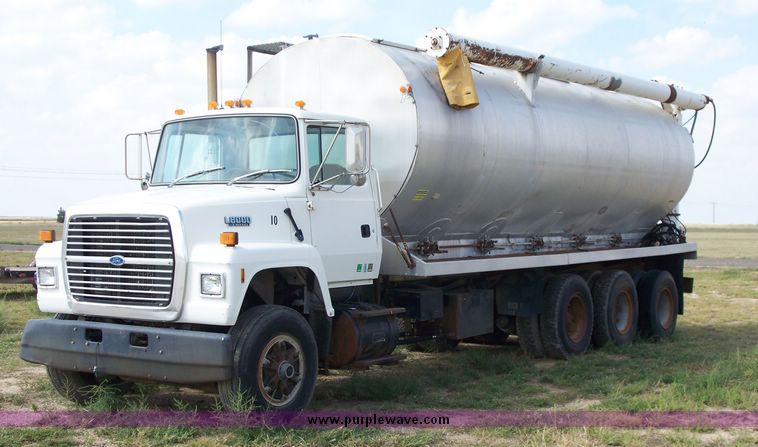 image for item 1103 1994 Ford L800 triple axle truck with Ledwell six bin feed delivery body