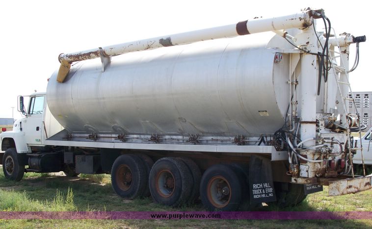 image for item 1103 1994 Ford L800 triple axle truck with Ledwell six bin feed delivery body