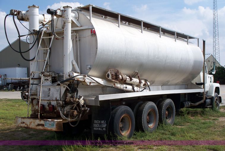 image for item 1103 1994 Ford L800 triple axle truck with Ledwell six bin feed delivery body