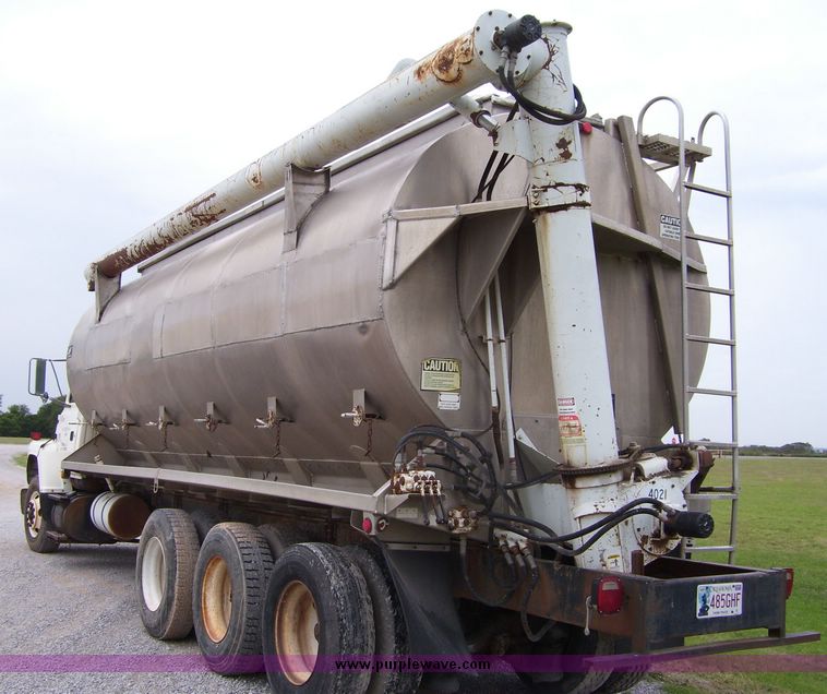 image for item 1107 1996 Ford LNT8000F triple axle food delivery truck with warren six bin feed body