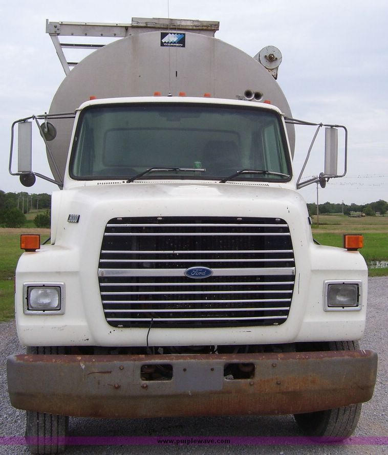image for item 1107 1996 Ford LNT8000F triple axle food delivery truck with warren six bin feed body