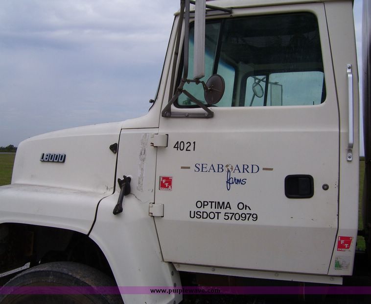 image for item 1107 1996 Ford LNT8000F triple axle food delivery truck with warren six bin feed body