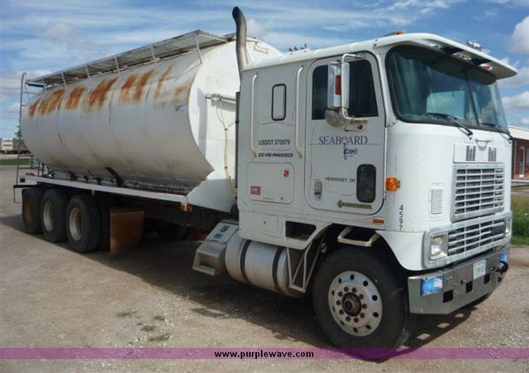 image for item 1110 1993 International 9000 Series 9600 triple axle cab over truck with steel six bin feed delivery body