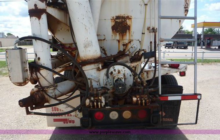 image for item 1110 1993 International 9000 Series 9600 triple axle cab over truck with steel six bin feed delivery body