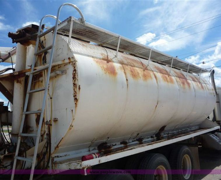 image for item 1110 1993 International 9000 Series 9600 triple axle cab over truck with steel six bin feed delivery body