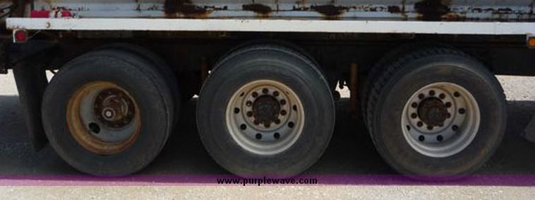 image for item 1110 1993 International 9000 Series 9600 triple axle cab over truck with steel six bin feed delivery body