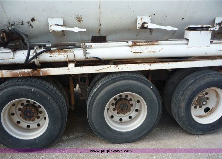image for item 1110 1993 International 9000 Series 9600 triple axle cab over truck with steel six bin feed delivery body