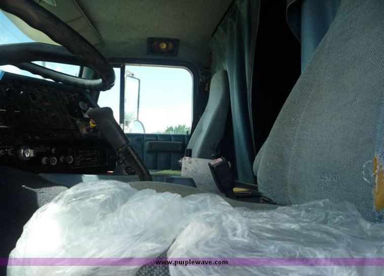 image for item 1110 1993 International 9000 Series 9600 triple axle cab over truck with steel six bin feed delivery body