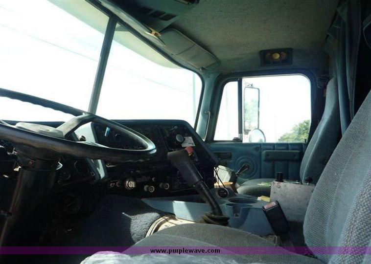 image for item 1110 1993 International 9000 Series 9600 triple axle cab over truck with steel six bin feed delivery body