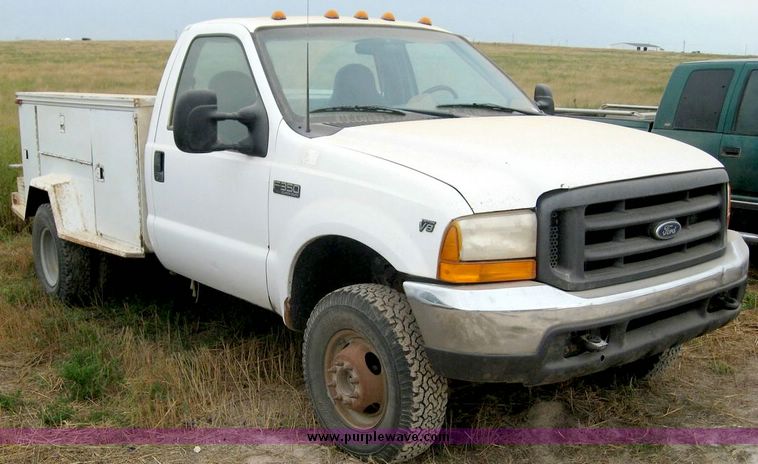 image for item 8719 1999 Ford F350 super duty pickup truck with utility bed
