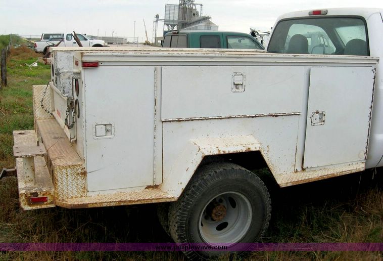 image for item 8719 1999 Ford F350 super duty pickup truck with utility bed