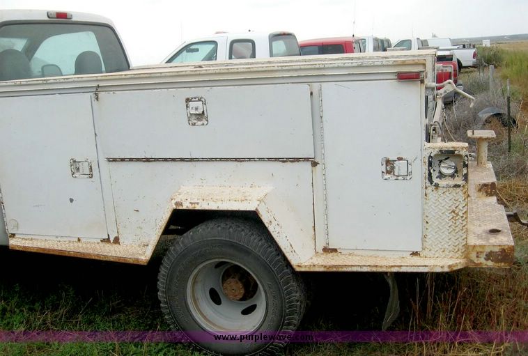 image for item 8719 1999 Ford F350 super duty pickup truck with utility bed