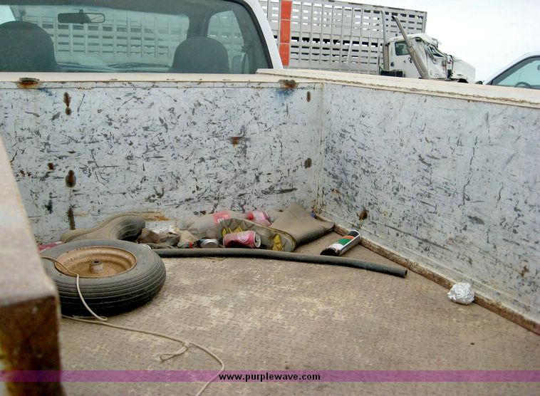 image for item 8719 1999 Ford F350 super duty pickup truck with utility bed