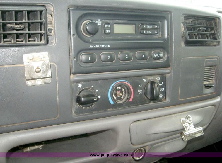 image for item 8719 1999 Ford F350 super duty pickup truck with utility bed